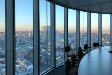 people sitting on chair near glass window during daytime